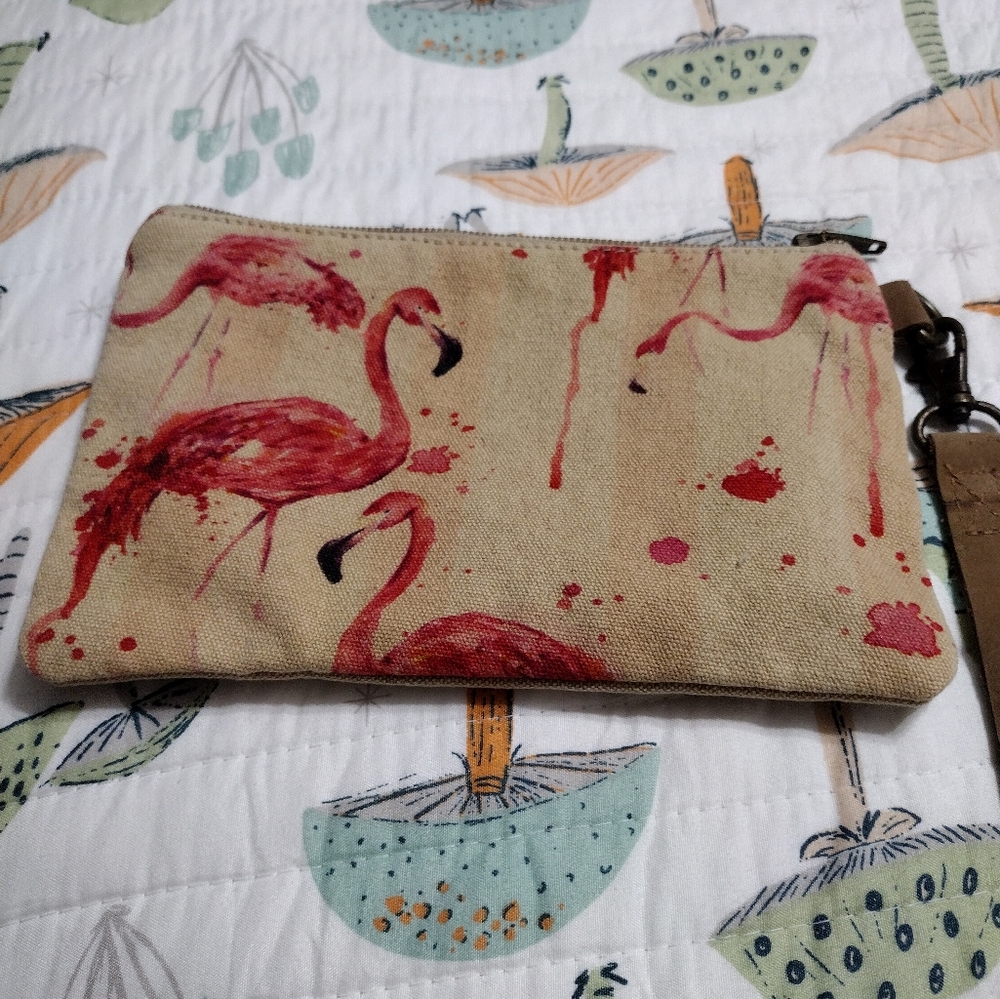 Flamingo wristlet with striped lining.
